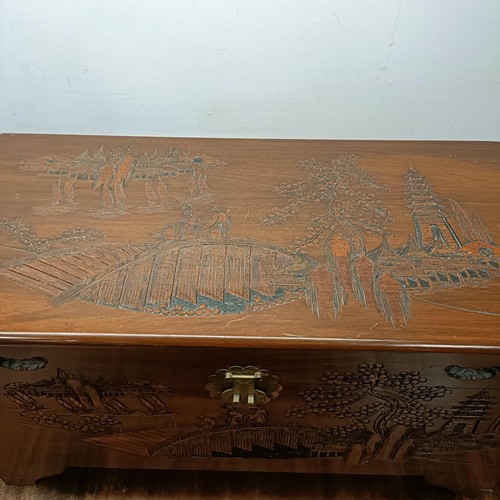 886 - A carved camphorwood trunk, 92 cm wide, a similar bureau, a magazine rack, two coffee tables, and a ... 