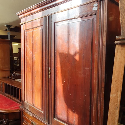 851 - A walnut linen press, 128 cm wide