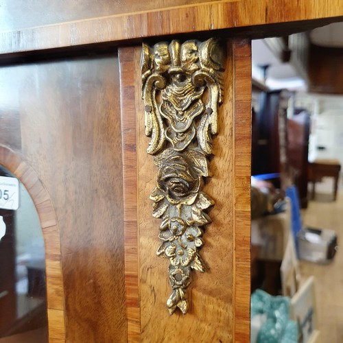 854 - A pair of walnut corner cabinets, with glazed doors, with gilt metal mounts, 80 cm wide