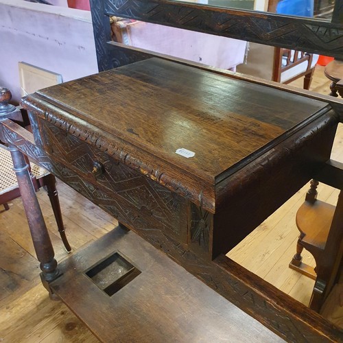 856 - A late Victorian carved oak hall stand, 115 cm wide