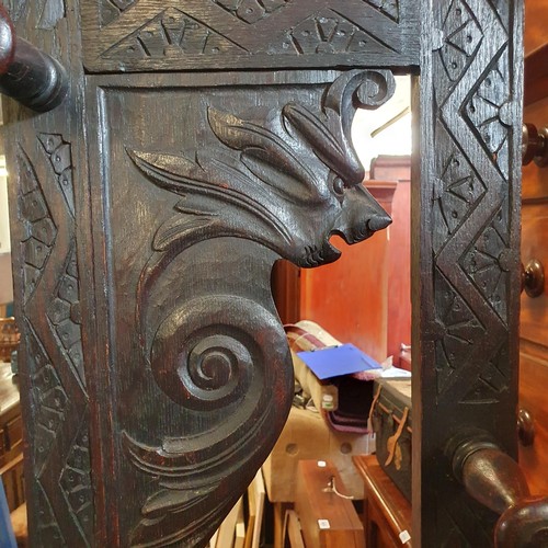 856 - A late Victorian carved oak hall stand, 115 cm wide