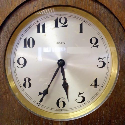 840 - A 1920s oak longcase clock, the silvered dial with Arabic numerals, to an eight day movement, 196 cm... 