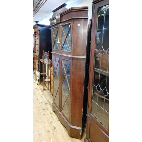 879 - A mahogany free standing corner cupboard, with four glazed doors, 187 cm high x 110 cm wide