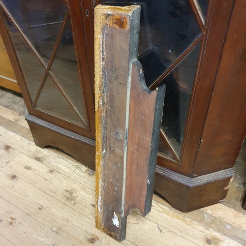 879 - A mahogany free standing corner cupboard, with four glazed doors, 187 cm high x 110 cm wide