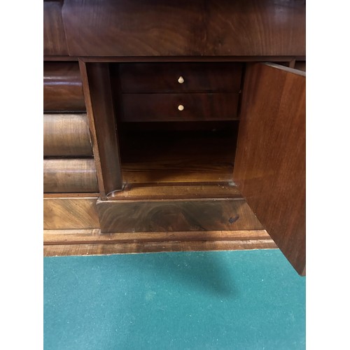 909 - A Continental mahogany escritoire, the top with two cupboard doors, above a full front and drawers, ... 