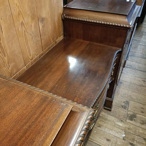 923 - An Edwardian mahogany sideboard, with two central drawers, flanked by a drawer and a cupboard, 198 c... 