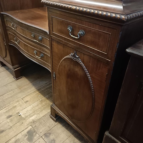 923 - An Edwardian mahogany sideboard, with two central drawers, flanked by a drawer and a cupboard, 198 c... 