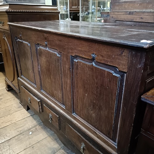 867 - An 18th century oak mule chest, the base with three drawers, 140 cm wide