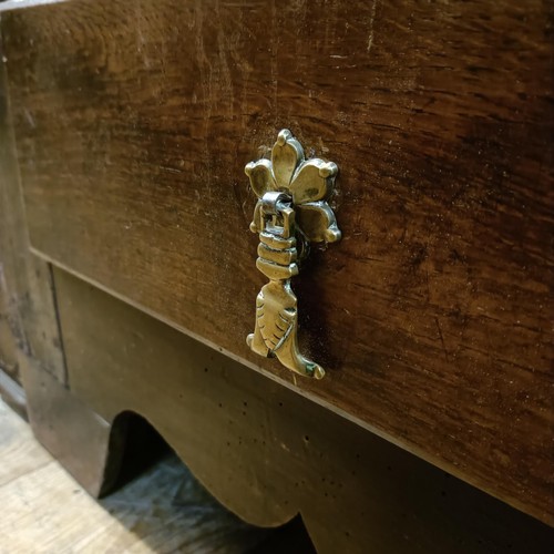 867 - An 18th century oak mule chest, the base with three drawers, 140 cm wide