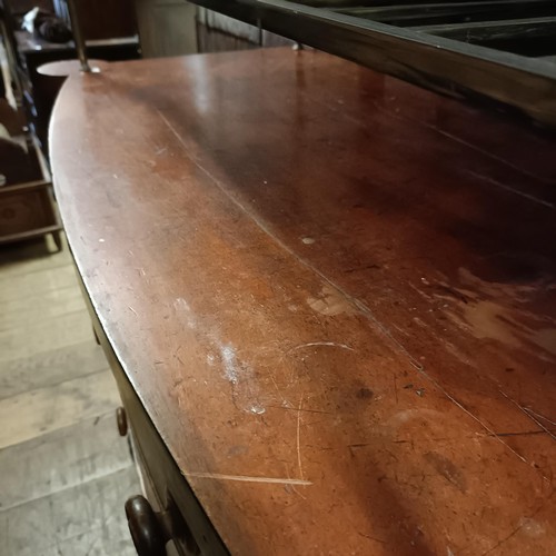 931 - A Victorian mahogany bow front chest, having two short and three long drawers, 133 cm wide