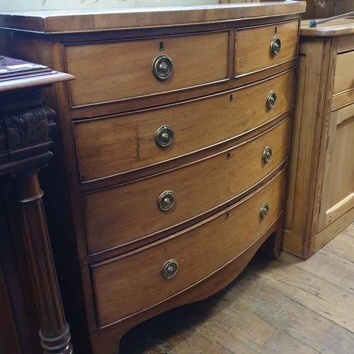 928 - A Victorian mahogany bow front chest, having two short and three long drawers, 100 cm wide