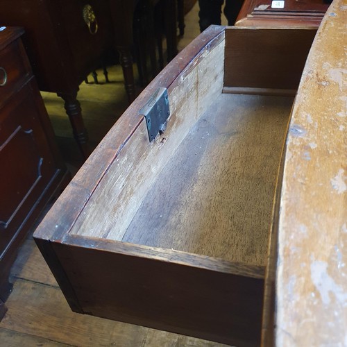 928 - A Victorian mahogany bow front chest, having two short and three long drawers, 100 cm wide