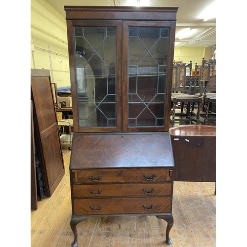 982 - A mahogany bureau bookcase, 89 cm wide