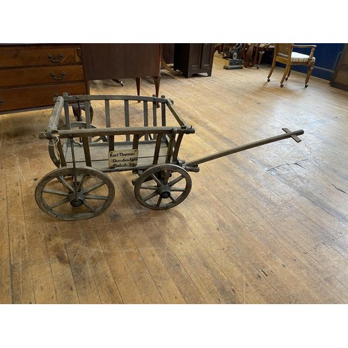 994 - A late 19th/early 20th century dog cart, with a label reading Karl Thomas, Dresden, N30, Rietzstr.54