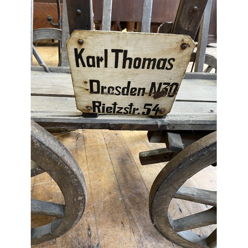 994 - A late 19th/early 20th century dog cart, with a label reading Karl Thomas, Dresden, N30, Rietzstr.54