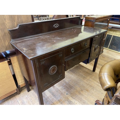 1035 - A Maple & Co mahogany sideboard, having two drawers, flanked by two cupboard doors, 153 cm wide