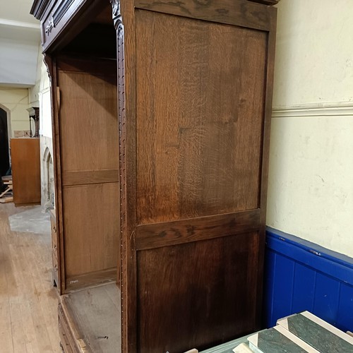 1008 - A French carved oak armoire, 150 cm wide