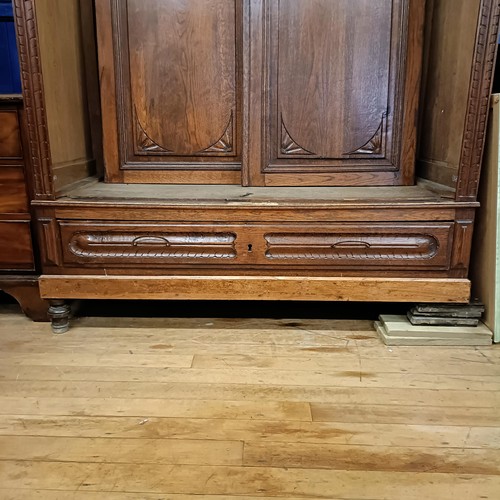 1008 - A French carved oak armoire, 150 cm wide