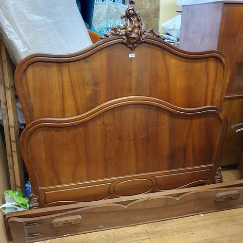 1003 - A French Louis XV style walnut double bed ends, 146 cm wide