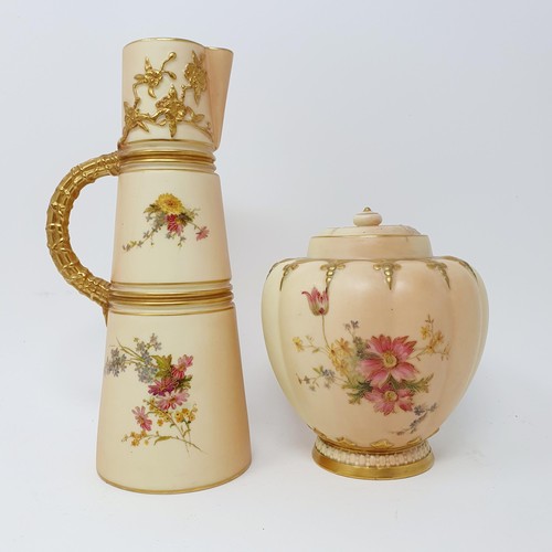 704 - A Royal Worcester blush ivory jug, decorated flowers, 23 cm high and two similar vases  (3)