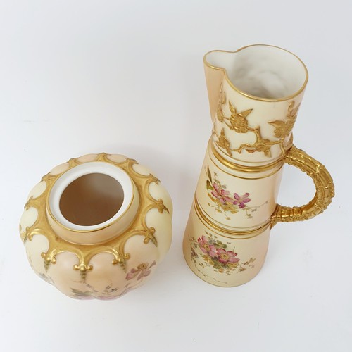 704 - A Royal Worcester blush ivory jug, decorated flowers, 23 cm high and two similar vases  (3)