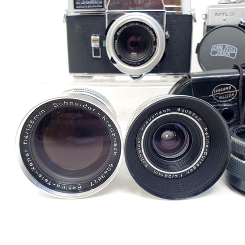 103 - A Kodak Retina Reflex III camera, with lenses, and a Praktica MTL3 camera, with lenses