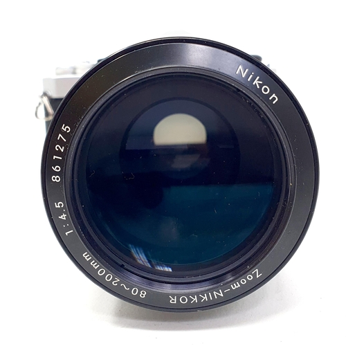 91 - A Nikon camera, with a telephoto lens