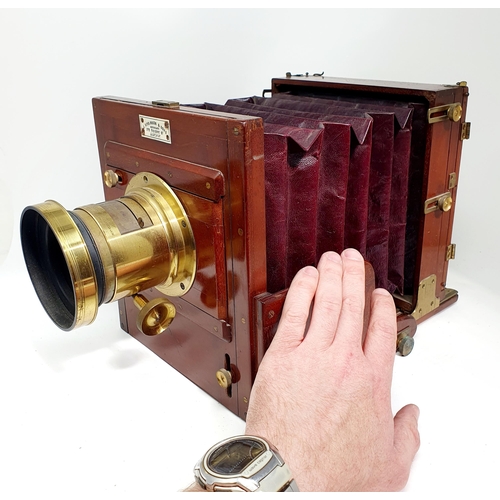 93 - An early 20th century mahogany and brass plate camera, by J R Robinson & Sons, 172 Regent Street, Lo... 