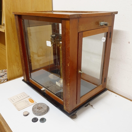 108 - A set of laboratory scales, in a mahogany case, 45 cm wide