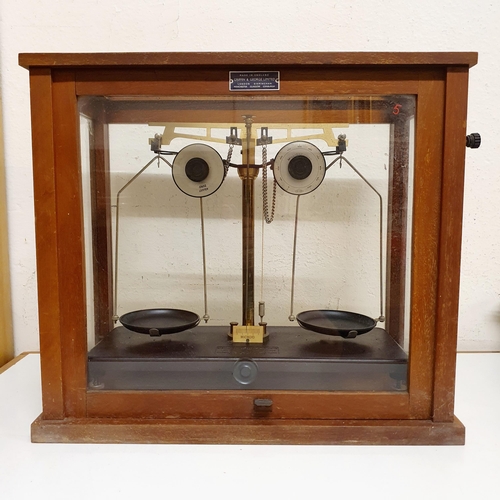 111 - A set of Griffin & George Ltd laboratory scales, in an oak case, 46 cm wide