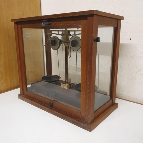 111 - A set of Griffin & George Ltd laboratory scales, in an oak case, 46 cm wide