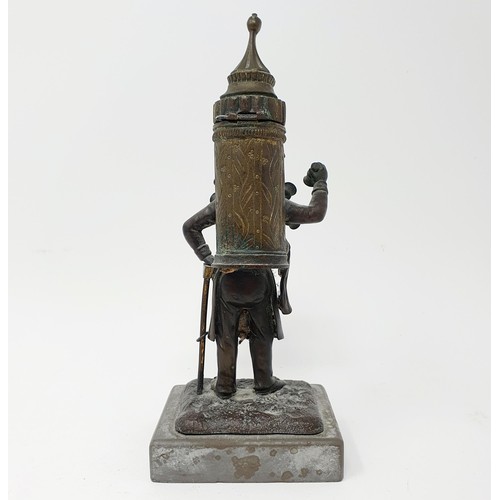 703 - A bronze, in the form of a street seller, on a polished stone base, 21 cm high and a bronze in the f... 