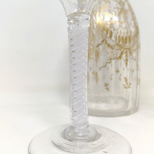 700A - A double cotton twist glass, another similar and a decanter and stopper with gilt decoration in the ... 