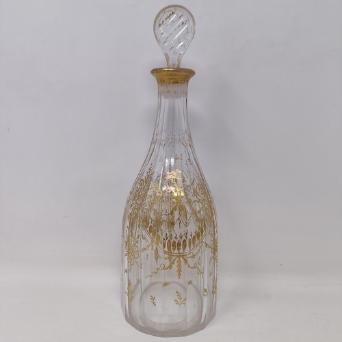 700A - A double cotton twist glass, another similar and a decanter and stopper with gilt decoration in the ... 