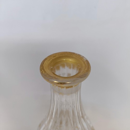 700A - A double cotton twist glass, another similar and a decanter and stopper with gilt decoration in the ... 