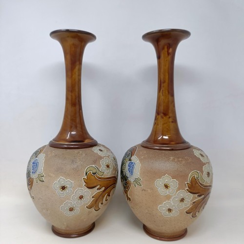 702 - A pair of Doulton & Slater vases, decorated flowers, 40 cm high