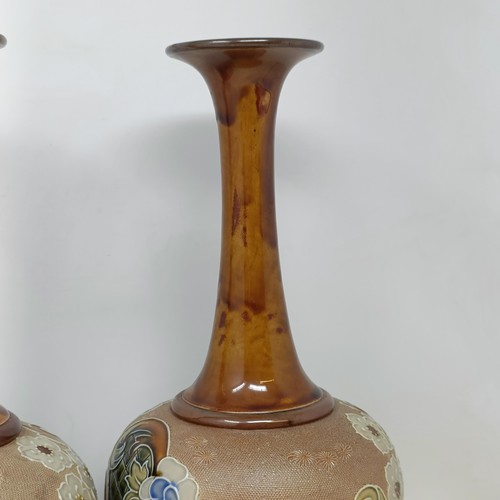 702 - A pair of Doulton & Slater vases, decorated flowers, 40 cm high