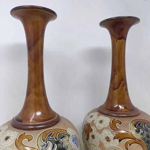 702 - A pair of Doulton & Slater vases, decorated flowers, 40 cm high