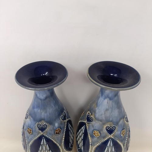 711 - A pair of Royal Doulton Art Nouveau style stoneware vases, 32 cm high