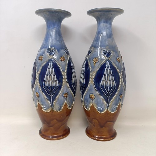 711 - A pair of Royal Doulton Art Nouveau style stoneware vases, 32 cm high