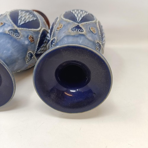 711 - A pair of Royal Doulton Art Nouveau style stoneware vases, 32 cm high