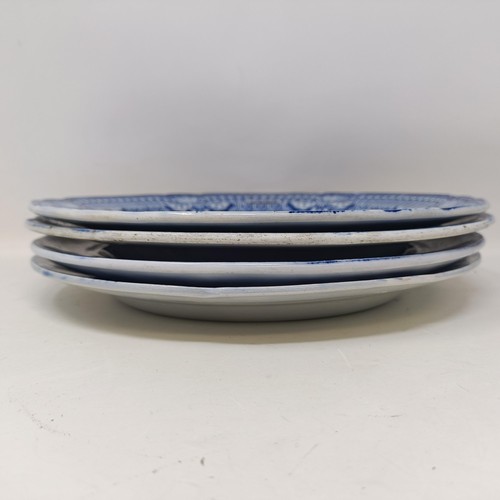 713 - A blue and white plate, decorated a landscape, 25 cm diameter, and three others (4)