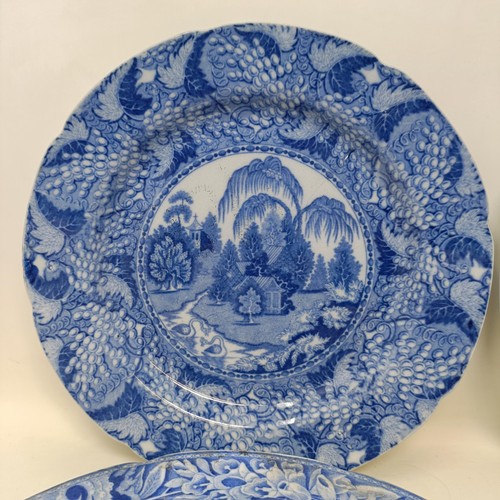 713 - A blue and white plate, decorated a landscape, 25 cm diameter, and three others (4)