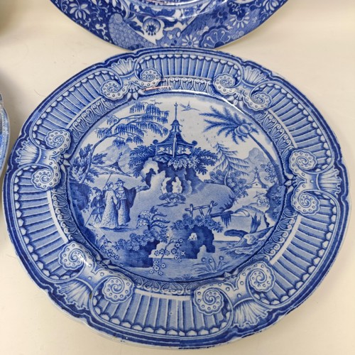 713 - A blue and white plate, decorated a landscape, 25 cm diameter, and three others (4)