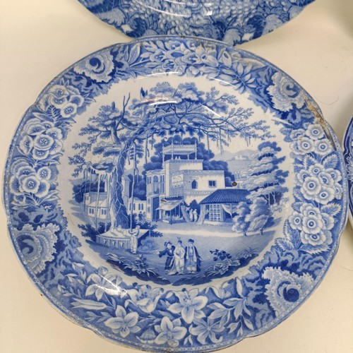 713 - A blue and white plate, decorated a landscape, 25 cm diameter, and three others (4)