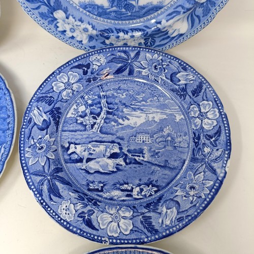 717 - A blue and white plate decorated cows, 25 cm diameter and five others similar (6)