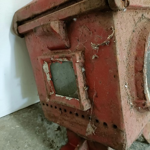 735 - A red painted cast metal railway stop lantern, and four other lanterns (5)