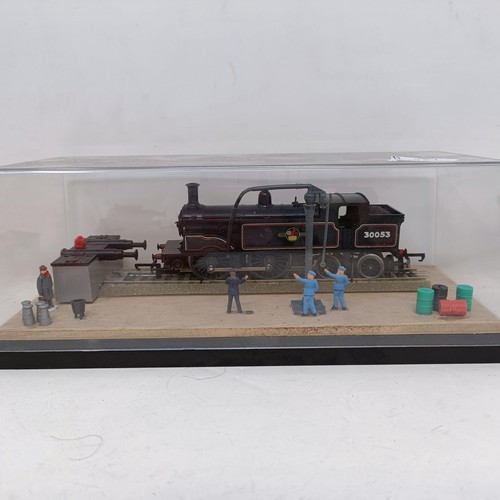 212 - A Hornby OO gauge 4-0-4 locomotive and trailer No. R157, R074, R761, R052 and R041, all boxed, and a... 