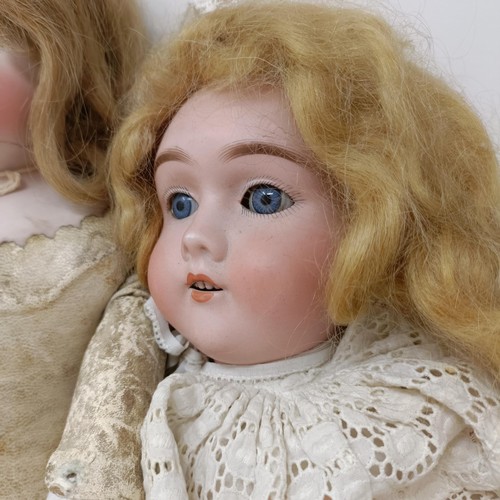 219 - A German bisque headed doll with closing millefiori eyes, and a leather and bisque jointed body, 42 ... 