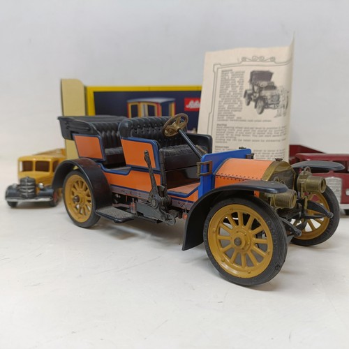 223 - A Schuco Tacho-Examico 4002 toy car, Schuco Akustico 2202, a reproduction Schuco Oldtimer boxed, and... 